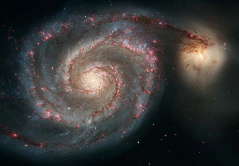 The Whirlpool Galaxy (M51) is the classic grand design spiral galaxy. It was the first object recognized as a spiral, though at the time astronomers thought they were nebulae. Astronomers have been pondering spiral galaxies for a long time, trying to understand how their spiral arms persist. New research has at least a partial answer. Image Credit: NASA, ESA, S. Beckwith (STScI) and the Hubble Heritage Team (STScI/AURA)