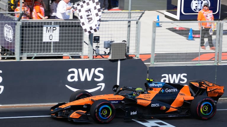 McLaren driver Lando Norris of Britain crosses the finish line to win the Formula One Hungarian Grand Prix auto race, at the Hungaroring racetrack in Mogyorod, near Budapest, Hungary.