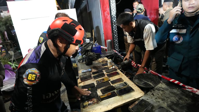 Mobile phones of victims of a fire are recovered in Bangkok, Thailand.