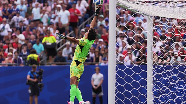 Morocco goalkeeper Yassine Bounou (1) reaches for the ball during the World Cup quarterfinal soccer match between France and Morocco.