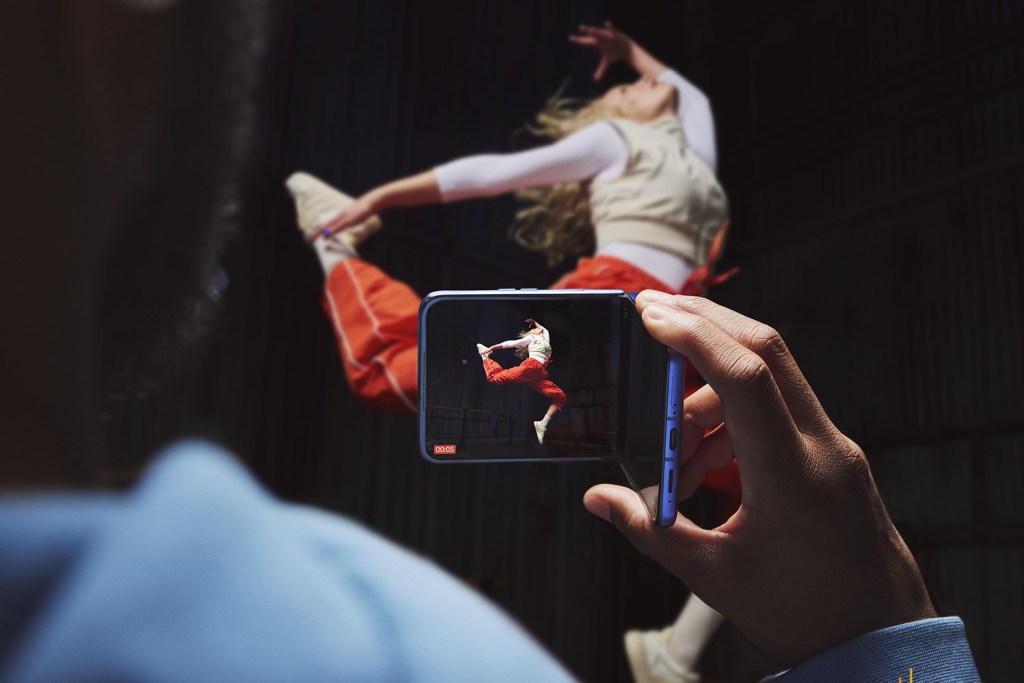 motorola razr 70 ultra in Orient Blue colourway used in a dance studio