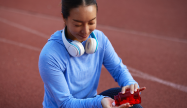 woman sitting on track with supplement pills