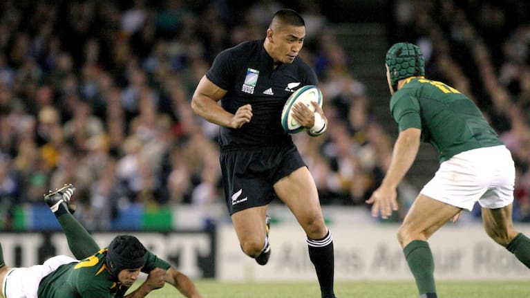 New Zealand number 8 Jerry Collins runs with the ball during the rugby World Cup quarter final match between New Zealand and South Africa at the Telstra Dome, Melbourne, in 2003.