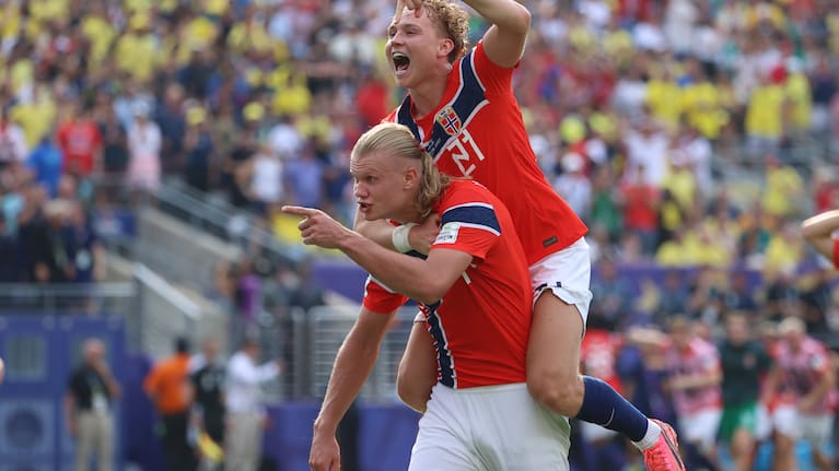 Norway's Erling Haaland (9) celebrates with Andreas Schjelderup (21) after scoring their second goal during the World Cup round of 16