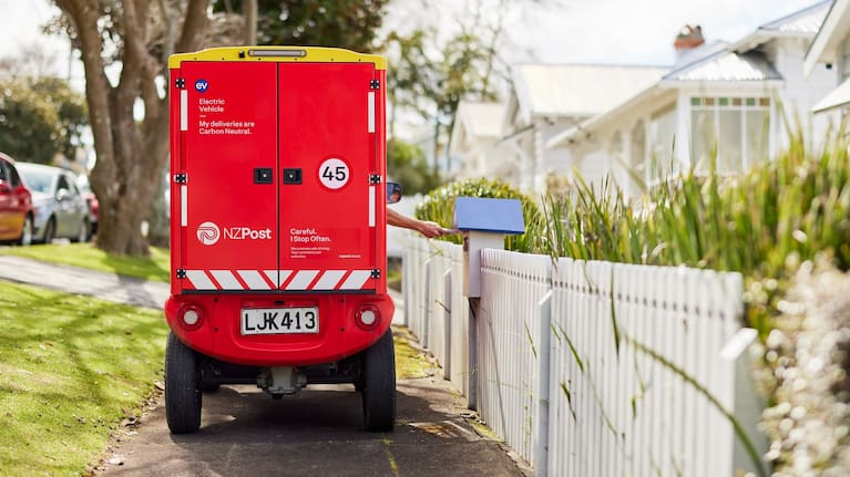 NZ Post paxter delivering letters.