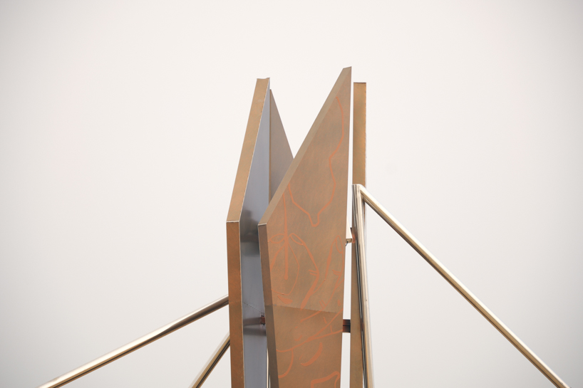 interconnected metal rods form a luminous winged installation on china's coastline - 2