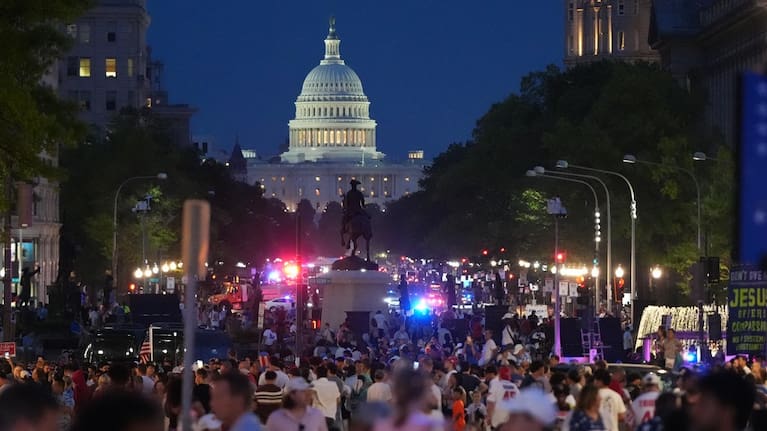 People crowd Pennsylvania Avenue after they were evacuated from the National Mall ahead of severe weather at an Independence Day event and fireworks honouring the nation's 250th anniversary.