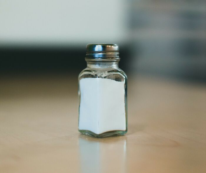 A salt shaker on a table, symbolizing a small but significant detail related to the medical industry.