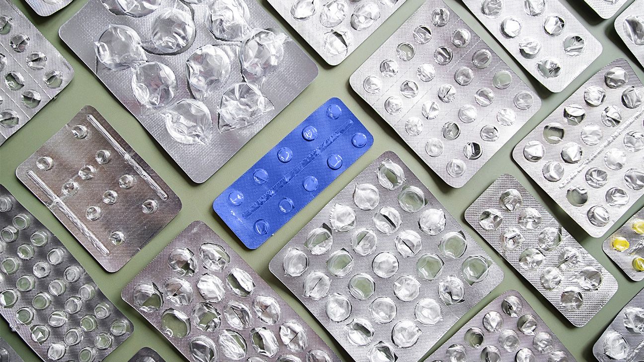 A group of various sized blister packs, with one blue one in the middle