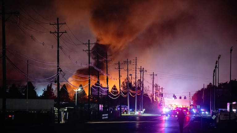 Plumes of smoke rise from the area of a UPS cargo plane crash at Louisville Muhammad Ali International Airport, November 4, 2025, in Louisville, Kentucky.