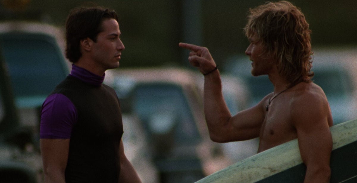 Keanu Reeves as FBI agent Johnny Utah and Patrick Swayze as Bodhi