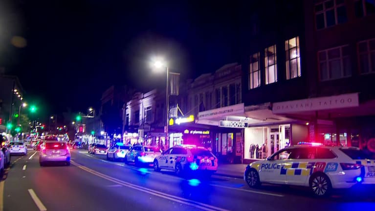 Police cars line Auckland's Karangahape Rd following reports of disorder.