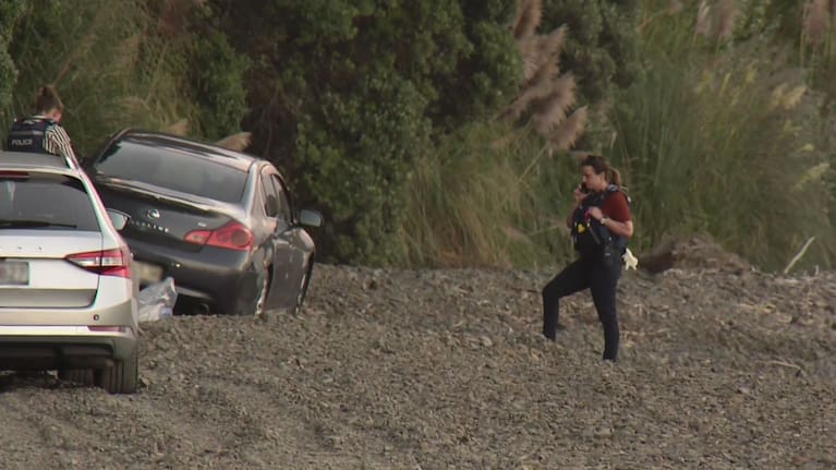 Police working at the scene on Ōrere Point Beach