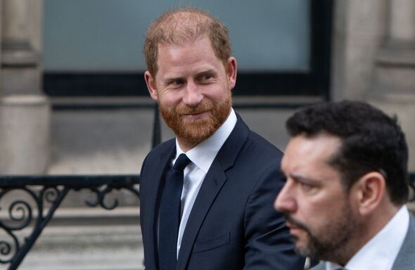 prince harry outside court wearing a suit