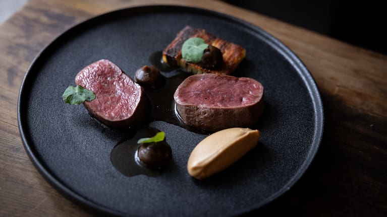 Rātā's Southland venison braised shank boulangère with celeriac and burnt apple.