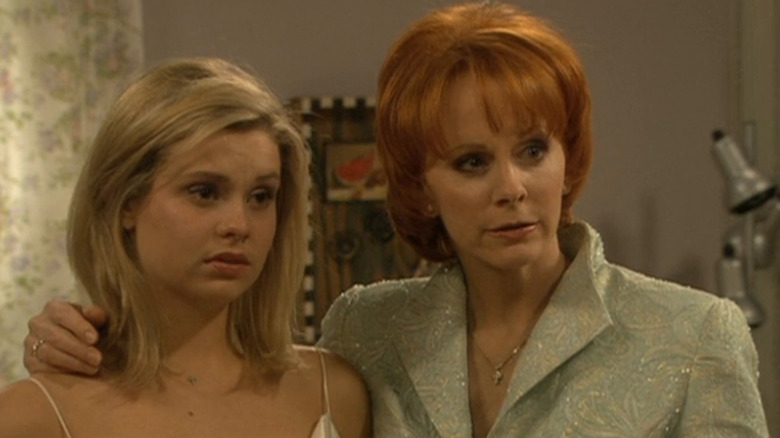 Reba with her arm around her daughter Cheyenne