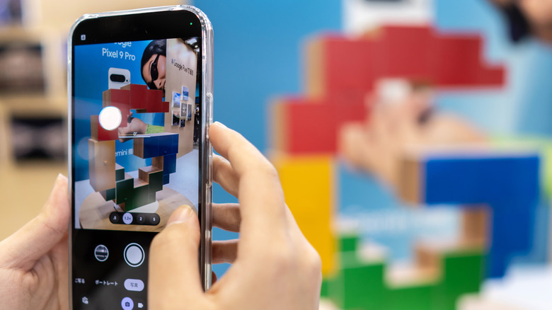 Pixel phone held in two hands while taking picture