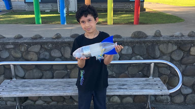 Rizal Hutton with the bottle rocket he built for a Vogeltown School science project — before it flew much further than anyone expected.