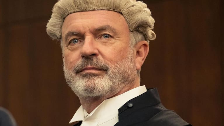 Sam Neill plays charismatic criminal defence lawyer Brett in The Twelve.