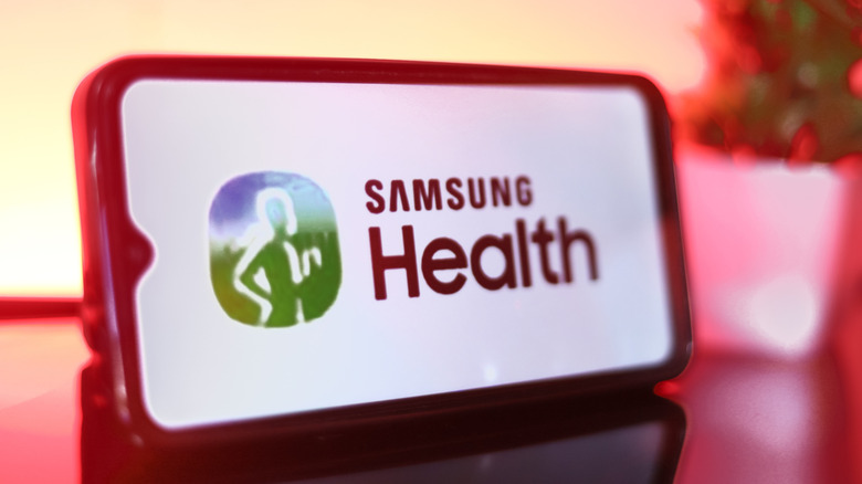 The Samsung Health logo on a smartphone