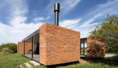 brick skin wraps weekend house with open courtyards in argentina
