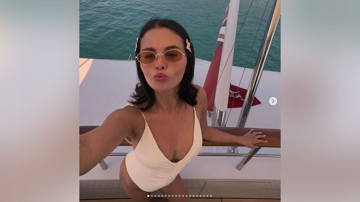 Selena Gomez on a yacht in a white bikini in an Instagram post shared in July 2026.