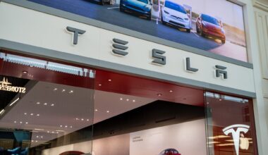Close up of Tesla storefront signage at shopping mall.