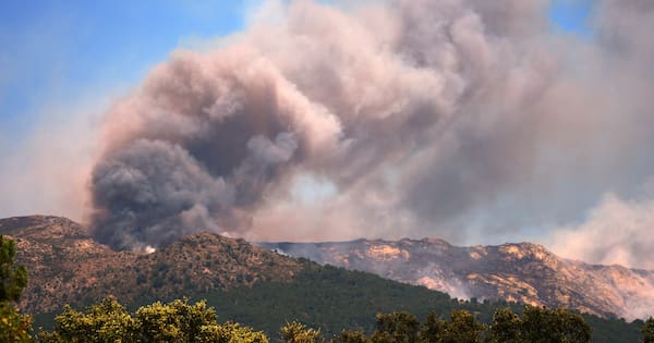 More than 200,000 people flee raging wildfires in France, Spain
