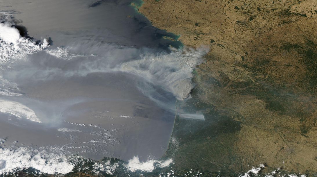 Layered satellite images show a cloud of smoke over southwest France on Monday, July 27, 2027.