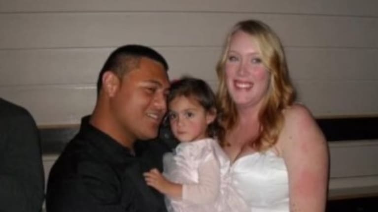 Sophia and Kole at their wedding with eldest daughter Ella.