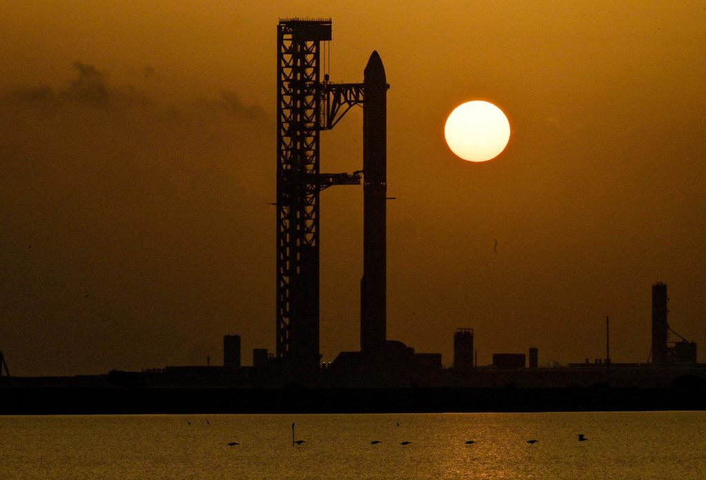 The Starship spacecraft and the Super Heavy v3 booster stand at Pad 2 at sunrise