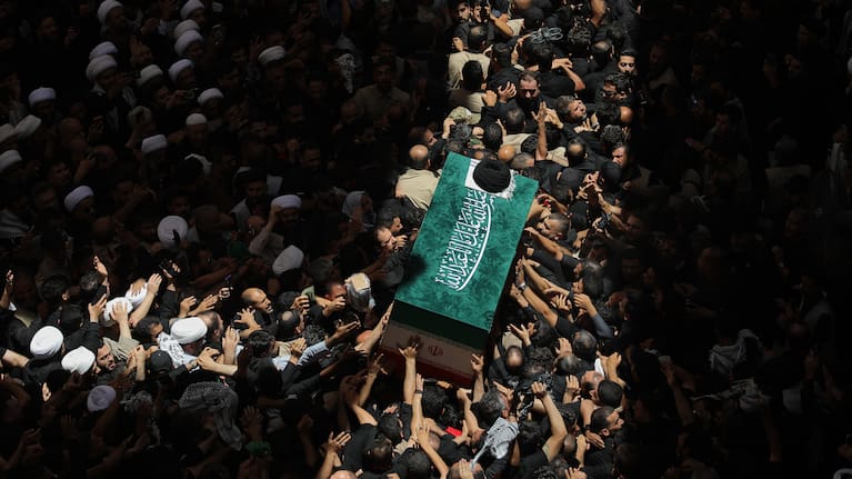 The coffin of the late Iranian Supreme Leader Ayatollah Ali Khamenei is carried by mourners to the Imam Ali Shrine in Najaf, Iraq, Wednesday, July 8, 2026.