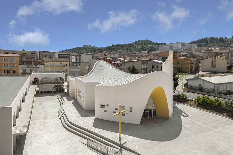 a flowing roof and fluid concrete walls frame the new santa barbara parish complex in sicily - 1