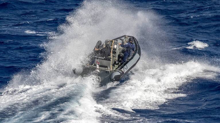 The New Zealand Navy comes to the rescue of an outrigger off Hawaii.