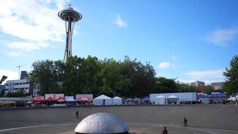 The US flag flies at half staff as cleanup continues at the Space Needle the day after a shooting at Seattle Centre during the Bite of Seattle food festival.