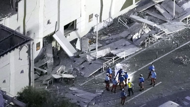 This aerial image shows rescue workers continue searching at the damaged AEON Mall after an earthquake in Kashima, Kumamoto prefecture, southern Japan, Tuesday, July 28, 2026.
