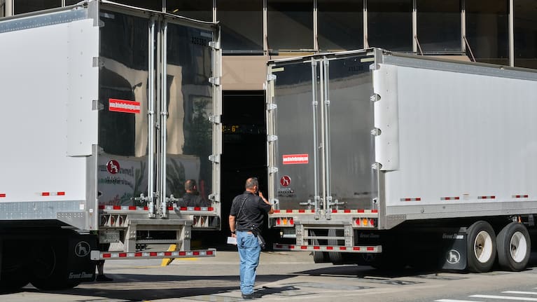 Trucks are moved into position to block photographer's view of the loading dock at New York's Madison Square Garden.