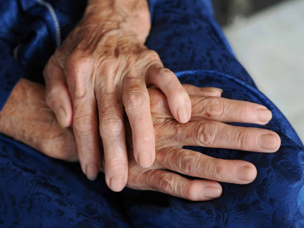 Wrinkled hands of an older person