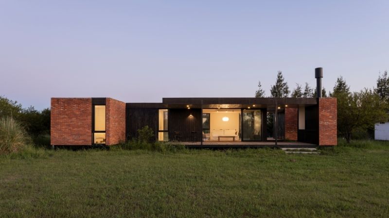 monolithic brick volumes wrap weekend house around a series of courtyards in argentina - 8