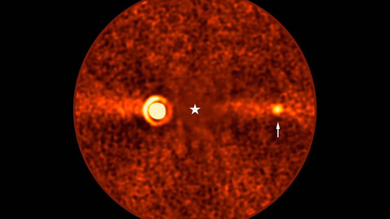 This image, taken with ESO&rsquo;s Very Large Telescope (VLT) shows Beta Pictoris d, a new planet found orbiting the star Beta Pictoris. The star is at the centre of the frame, and was subtracted when processing the data, revealing the environment around it. The new planet, indicated with an arrow, is the third one found around this star. The other two are Beta Pictoris b &ndash;&ndash; the bright source to the left, and Beta Pictoris c, orbiting much closer to the star and not seen here. The image was taken with the ERIS instrument at the VLT. Based on its infrared brightness and colour, the new planet appears to be a gas giant, about 2.4 times more massive than Jupiter. The diffuse horizontal band in this image is a debris disc around the star, seen here edge-on, the leftover material of planetary formation.