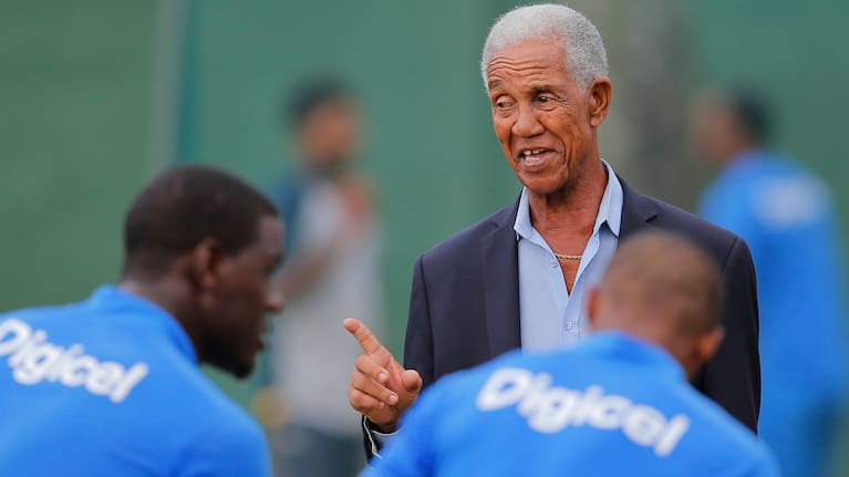 West Indies cricket great Garfield Sobers, right, chats with West Indies team members during a training session.