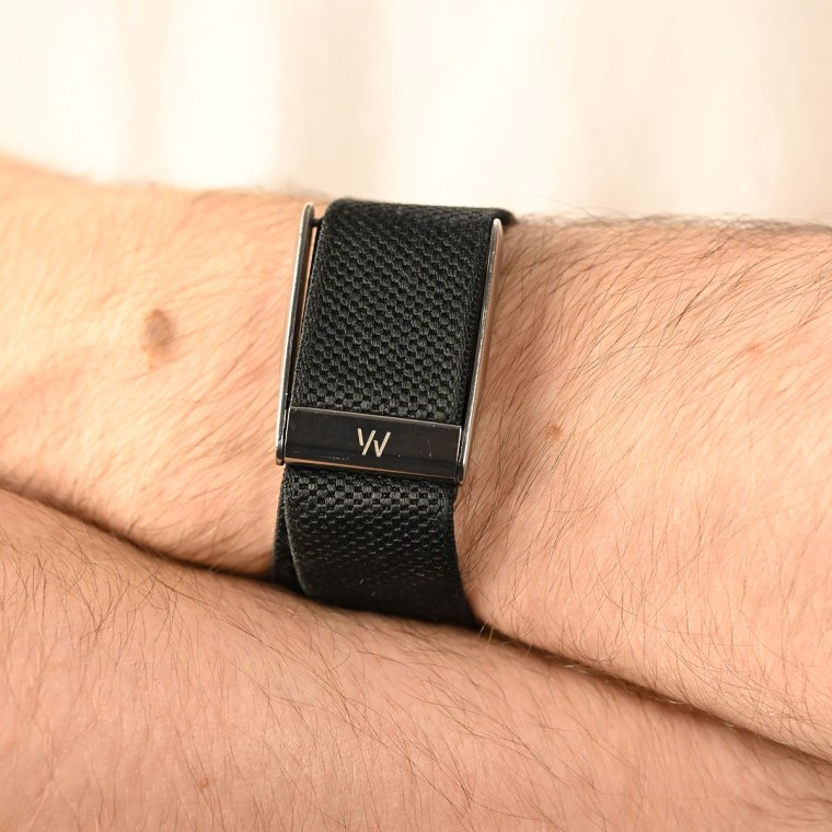 A close-up of the Whoop MG on the wrist of the writer.