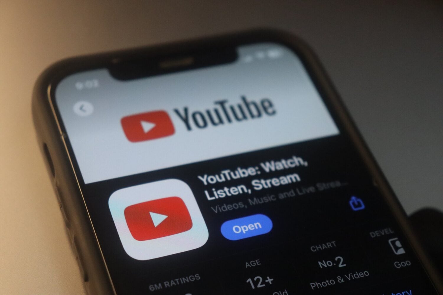 YouTube logo displayed on a smartphone