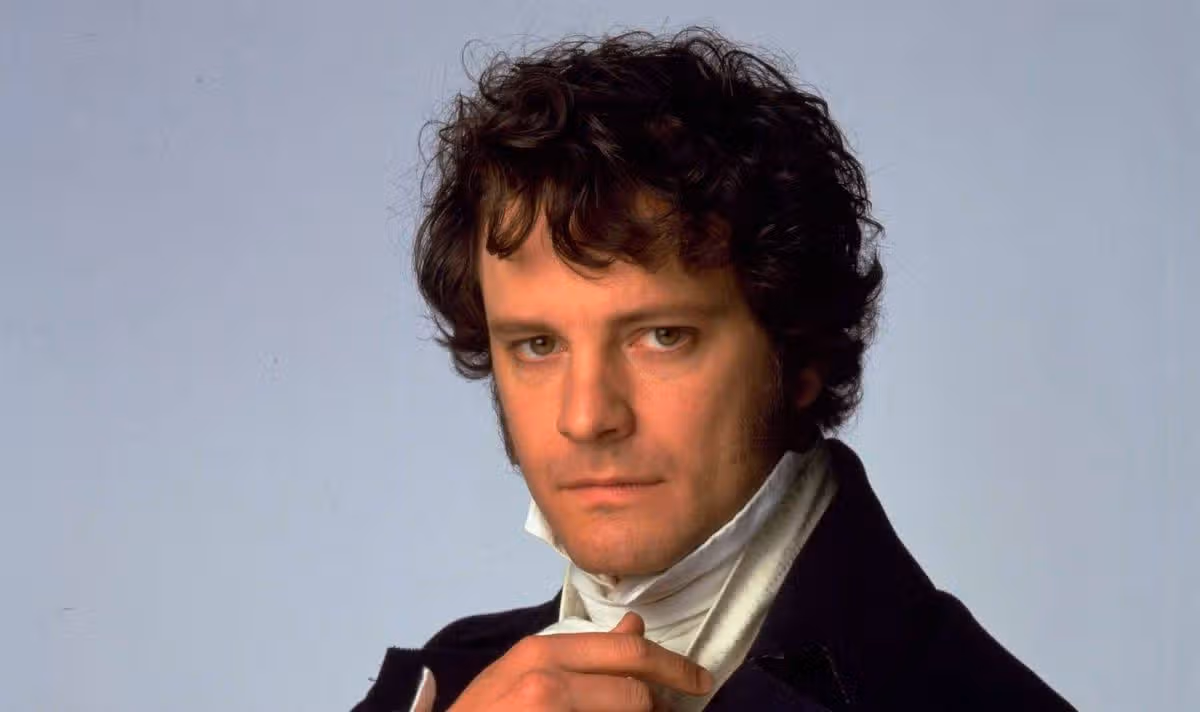 A man with dark hair looks serious