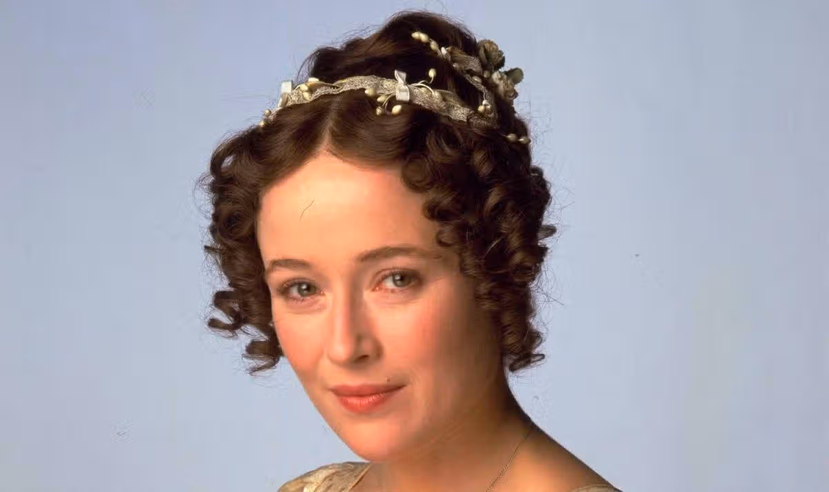 A woman with hair accessories looks serious