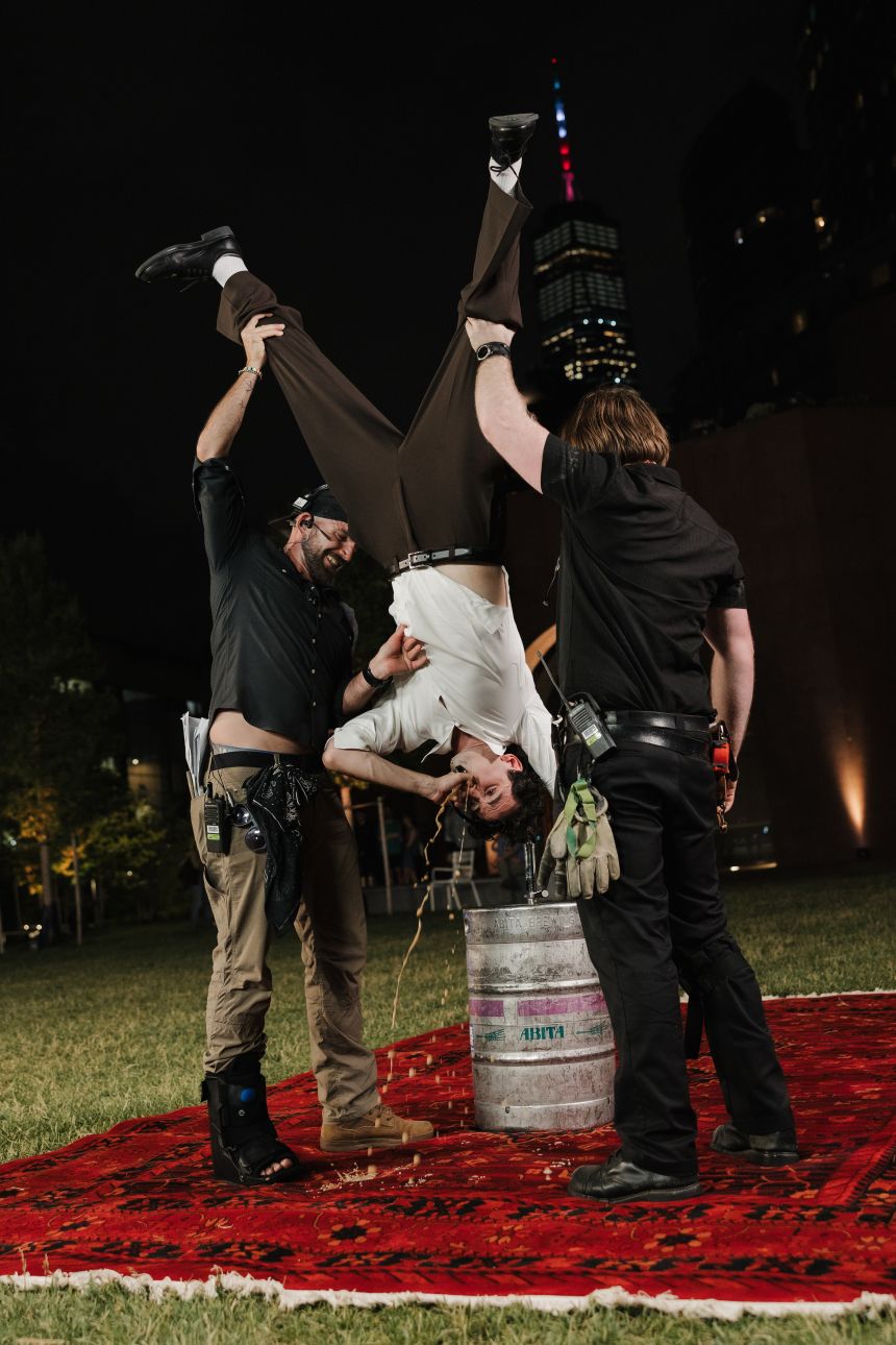 Julian Shapiro-Barnum does his first ever keg stand, with some help.