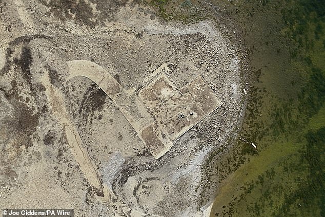 The ongoing drought has made the reservoir shrink back and expose the old ruins