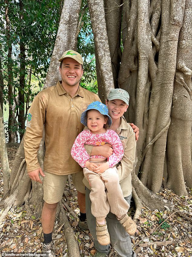 Bindi Irwin has given fans a glimpse of her husband Chandler Powell's impressive physique in a sweet family photo from the Australian outback. (Pictured with their daughter Grace Warrior, five)