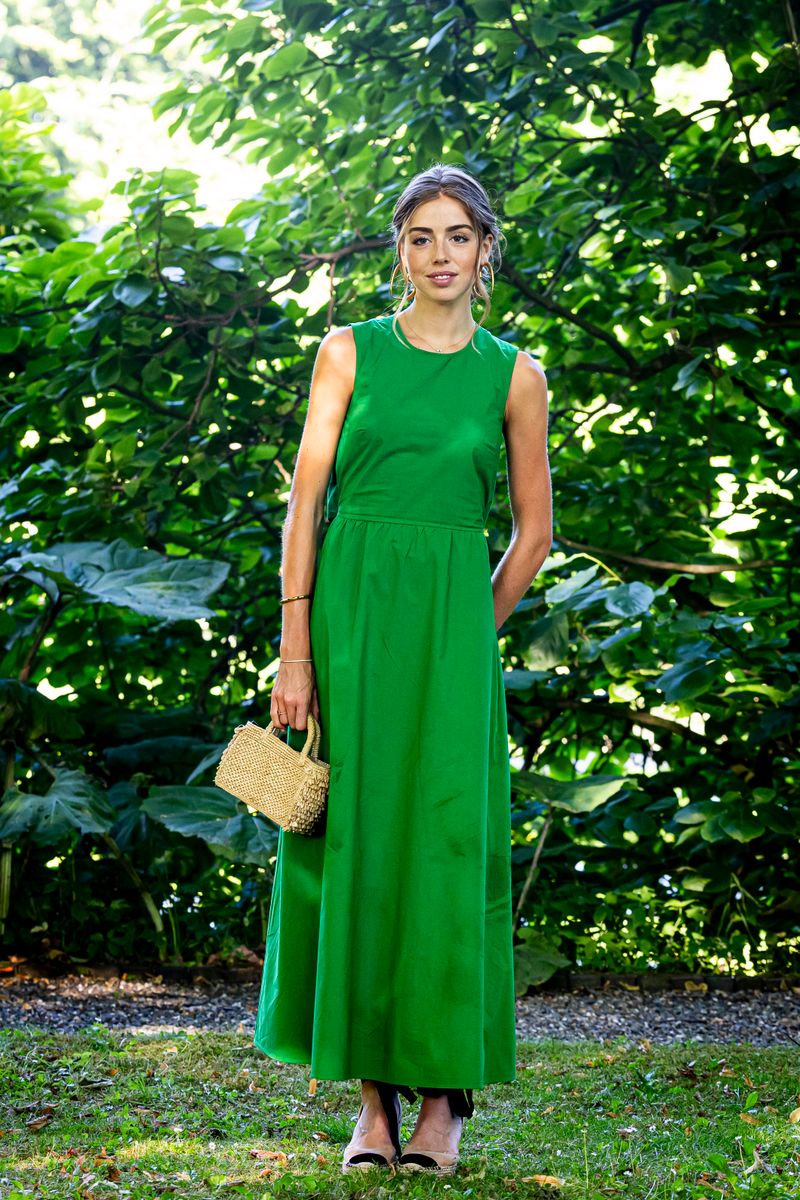 The Dutch princess paired a green Reiss dress with a statement Mango obi belt and Gianvito Rossi boots for the royal family's 2026 summer photo session.