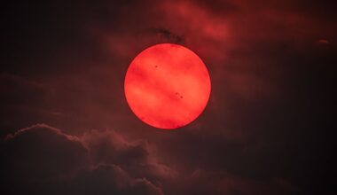 APOD: 2026 July 30 - Red Sun trough Wildfire Smoke